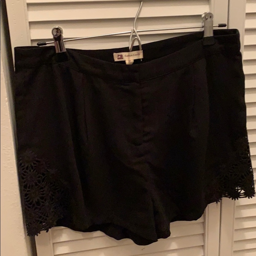 Black dress shorts with lace detail on the sides